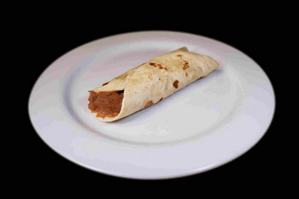 Bean-filled burrito on a white plate