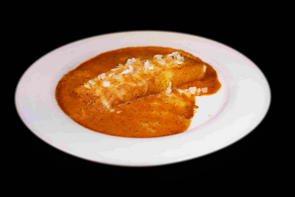 Tortilla covered in enchilada sauce