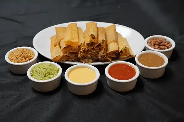 tamales with variety of sauces