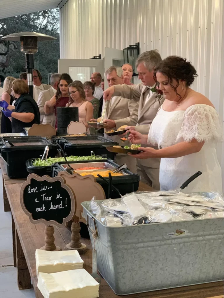 Wedding guests at taco buffet.