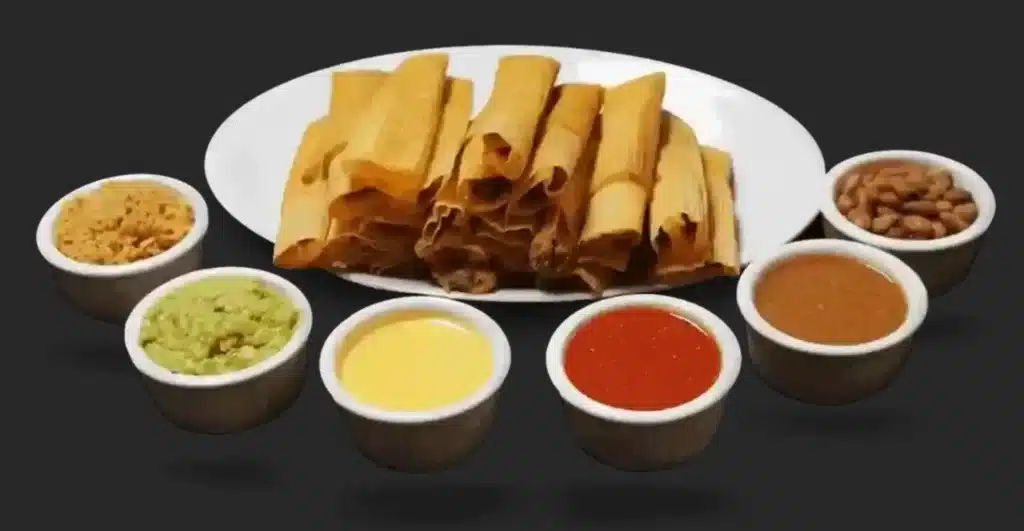 A plate of tamales with sauces