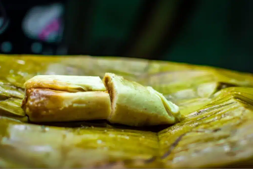 Partially opened tamale on a leaf