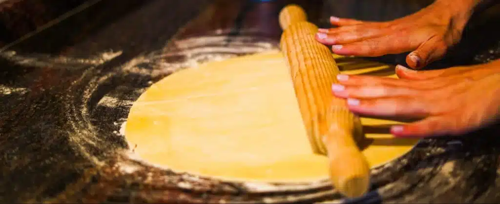 Rolling dough with a wooden pin