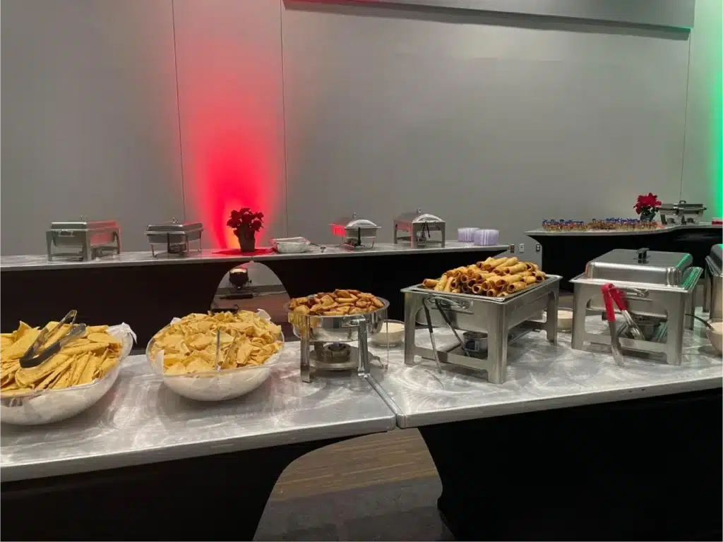 Mexican buffet setup with chips and taquitos.