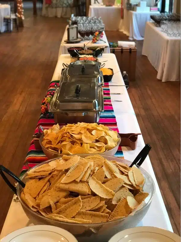 Mexican buffet table setup with chips.