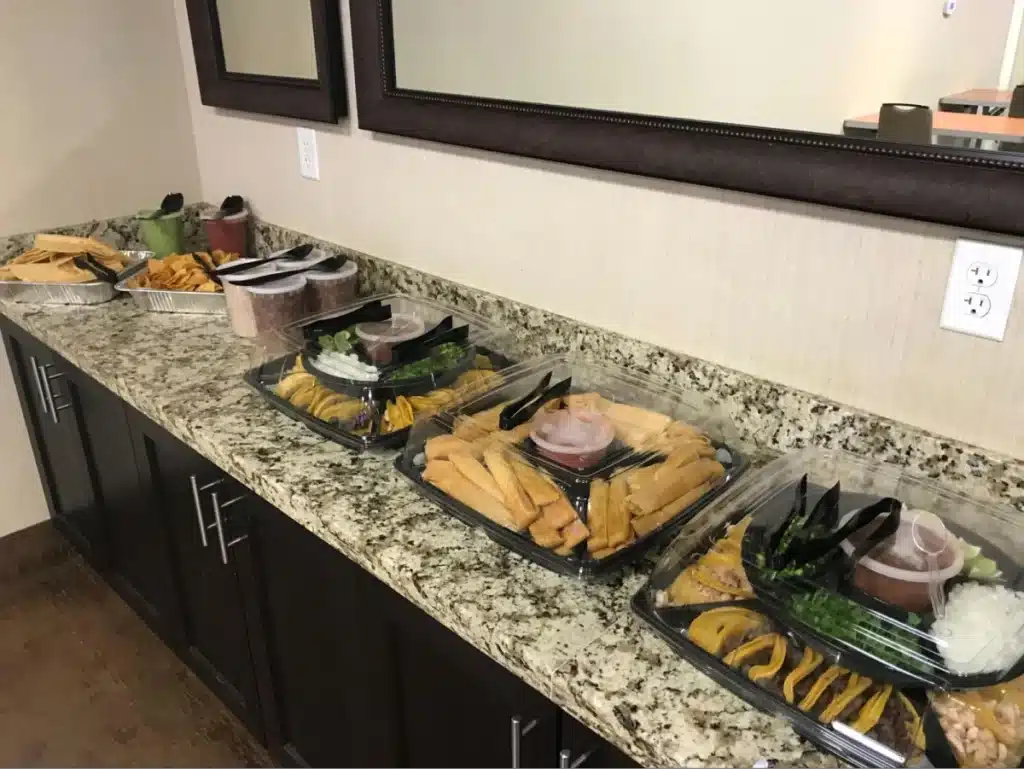 Buffet-style food spread on counter.