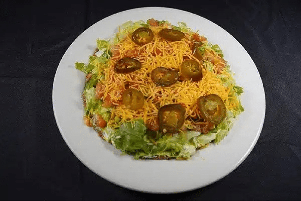 Taco salad with jalapeños and cheese.