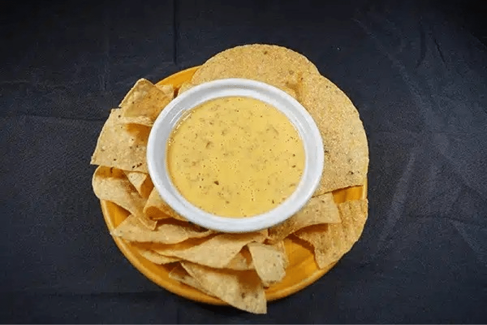 Chips with queso dip.